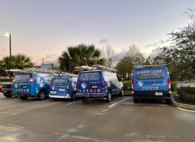 The A New Leaf Painting vans parked together